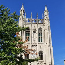 The Memorial Union tower against a clear blue sky.